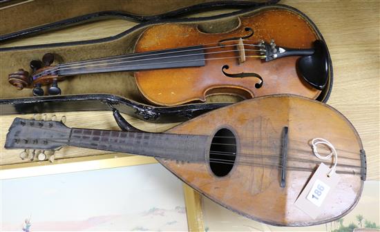 A mandolin and a cased violin